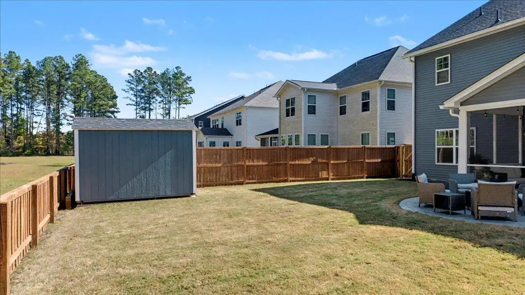 Exterior details and patio area of a home in Hewing Farms, Summerville (Image 4). Exterior details and patio area of a home in Hewing Farms, Summerville (Image 4).