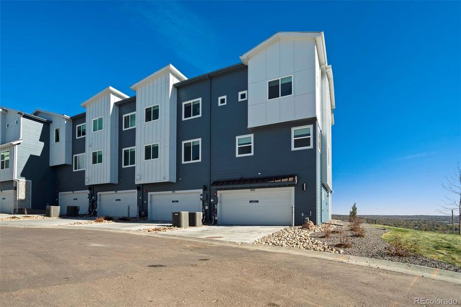 Front exterior of a new home in , Colorado Springs, CO, highlighting curb appeal (Image 1). Front exterior of a new home in , Colorado Springs, CO, highlighting curb appeal (Image 1).