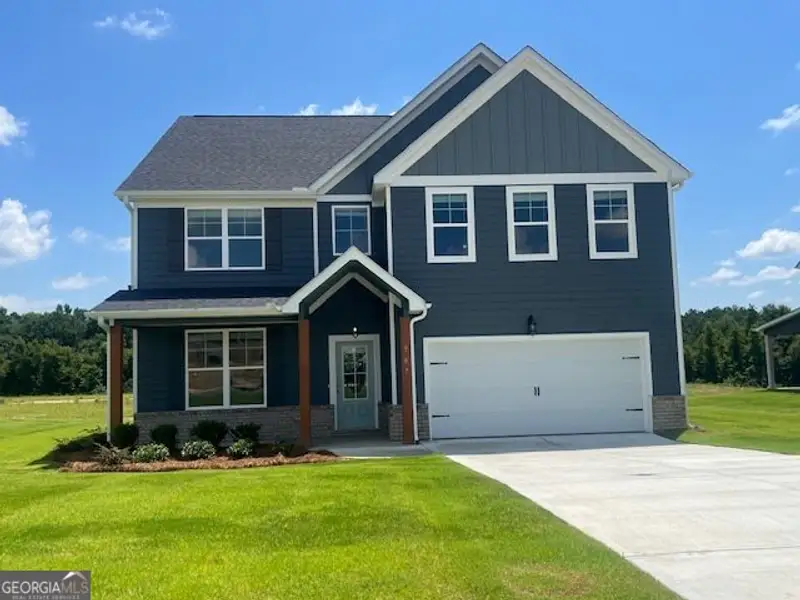 Front exterior of a new home in Harley Farms South, Bonaire, GA, highlighting curb appeal (Image 1). Front exterior of a new home in Harley Farms South, Bonaire, GA, highlighting curb appeal (Image 1).