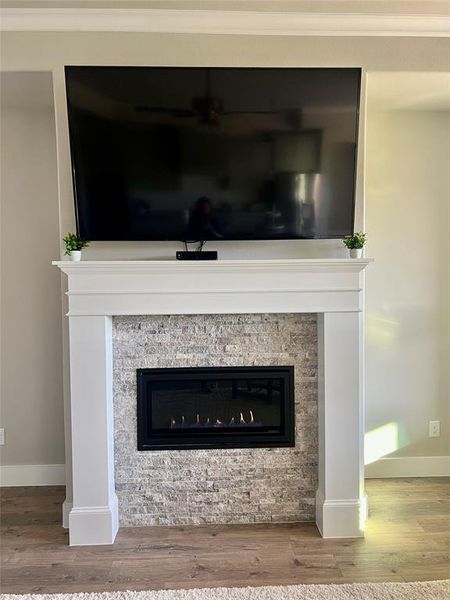 Family room with a beautiful electric start gas fireplace insert to warm you up with the flip of a switch, then easily turn off the switch and leave the home or go to bed with no worry.