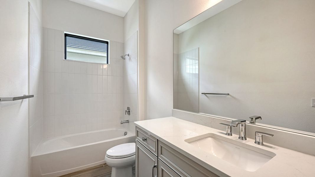 Furnished interior view inside a new home in Palm Grove Real Estate and Homes for Sale in Lakewood Ranch, FL - Neal Communities, Bradenton (Image 11).