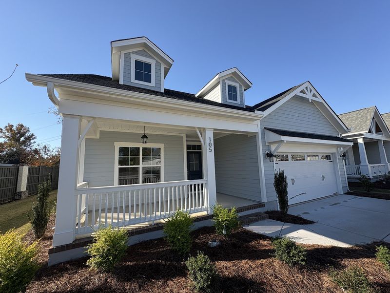 Front exterior of a new home in Riverside Cove, Wilmington, NC, highlighting curb appeal (Image 24).
