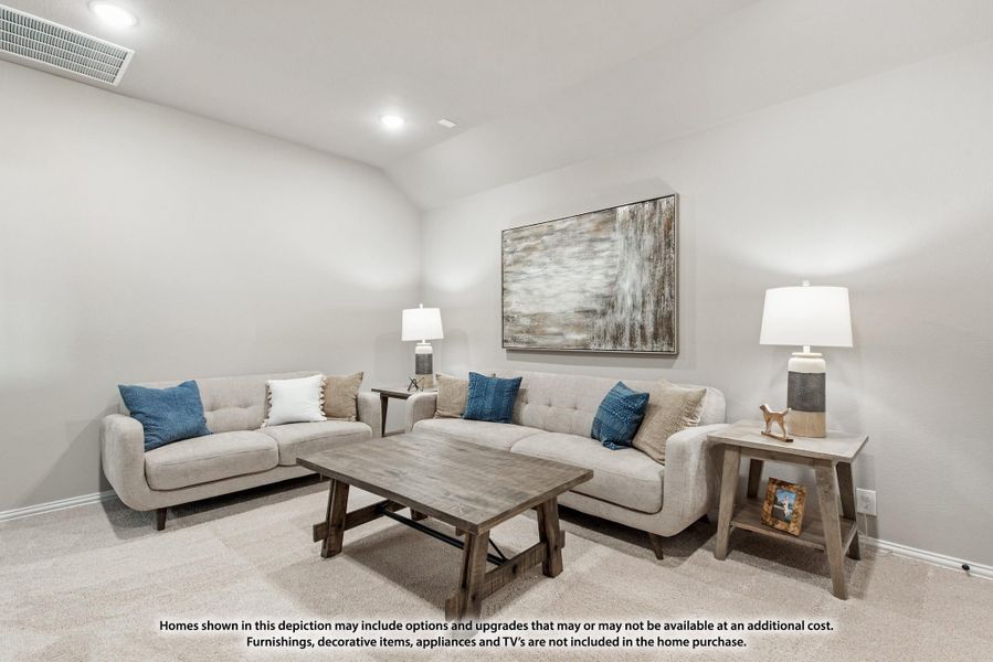 Living room with two beige sofas, wood coffee table, and vaulted ceiling with recessed lighting