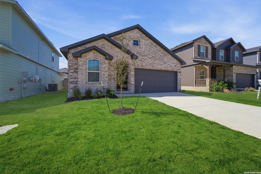 Front exterior of a new home in Laurel Vistas, San Antonio, TX, highlighting curb appeal (Image 2).