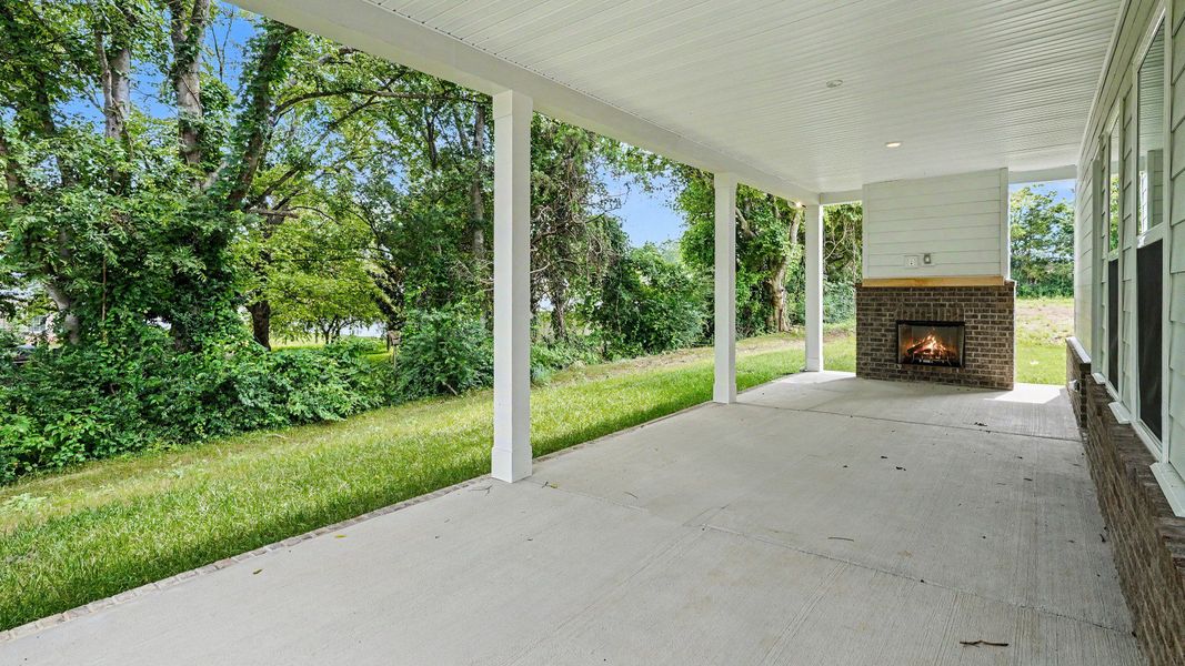Covered rear patio with fireplace Covered rear patio with fireplace