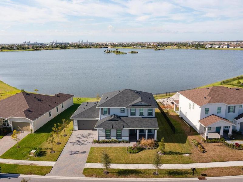 Front exterior of a new home in , The Acreage, FL, highlighting curb appeal (Image 25). Front exterior of a new home in , The Acreage, FL, highlighting curb appeal (Image 25).