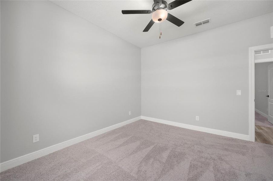 Spacious, unfurnished interior of a new home in Gum Lake Preserve, Lake Alfred (Image 13).