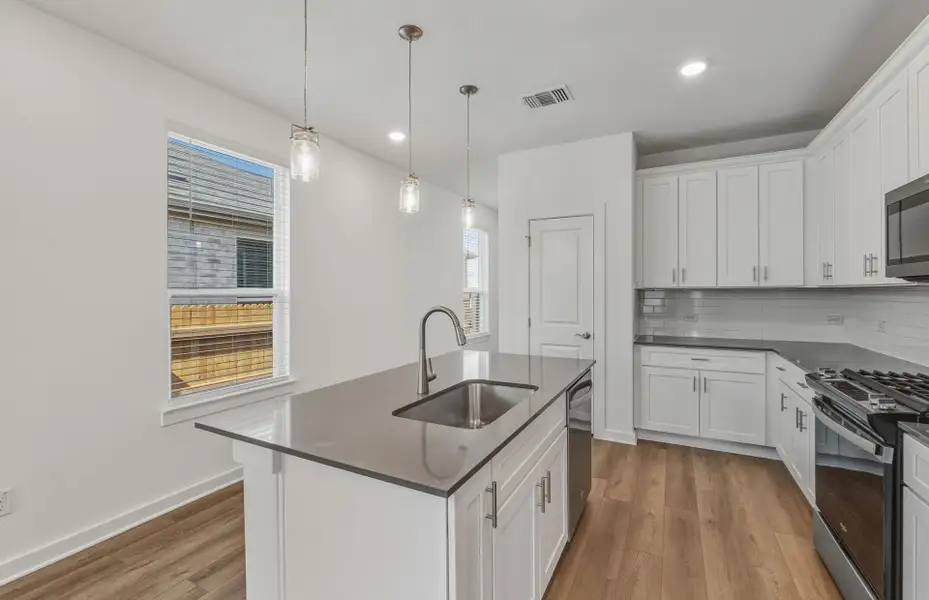 Furnished interior view inside a new home in Crosswinds, Kyle (Image 5).