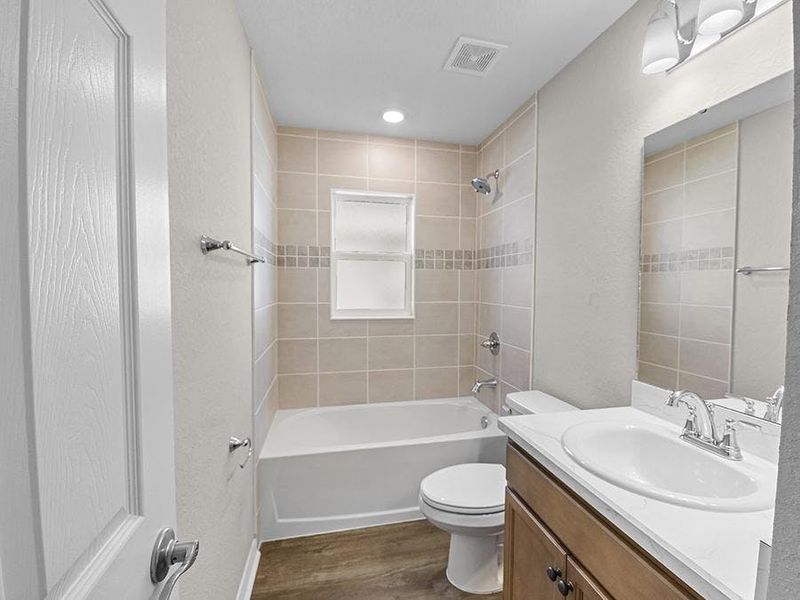 Secondary bedrooms share a convenient hall bath.