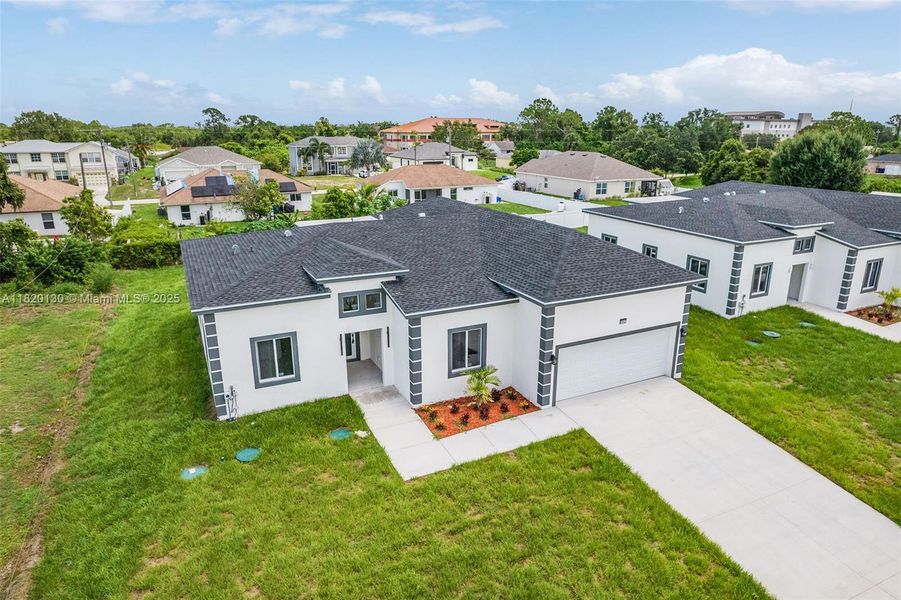 Front exterior of a new home in , Lehigh Acres, FL, highlighting curb appeal (Image 2).