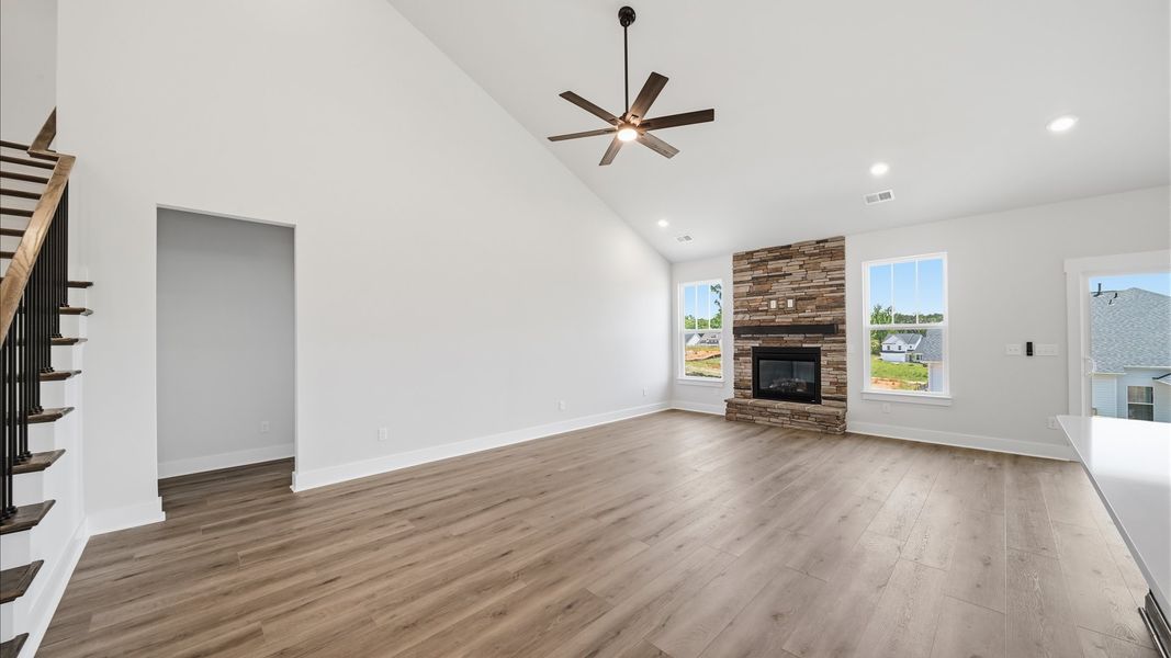 Refined and memorable, this family room features two-story ceilings and top-notch comfort throughout in Moore, SC