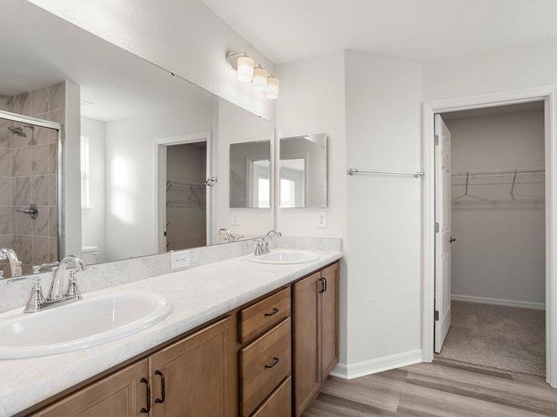 Your suite is complete with a walk-in wardrobe and a private en-suite bath.