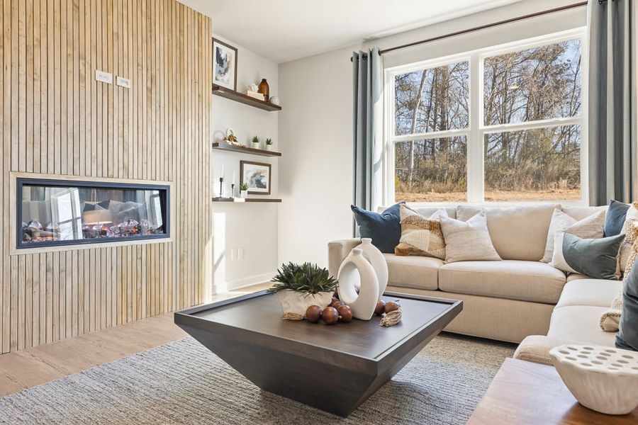 A living room with a fireplace.