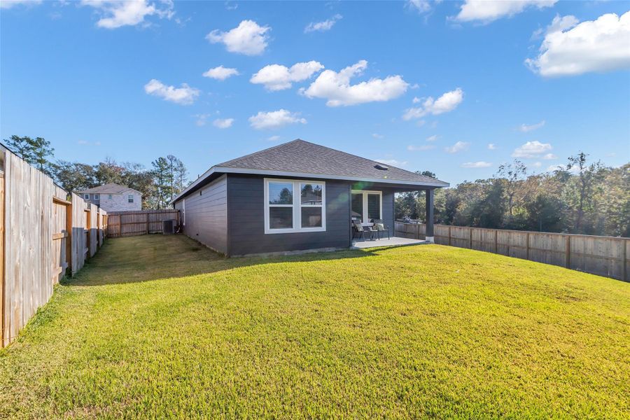 Large corner lot - with no neighbors on the right side.  View from back yard towards back of home.