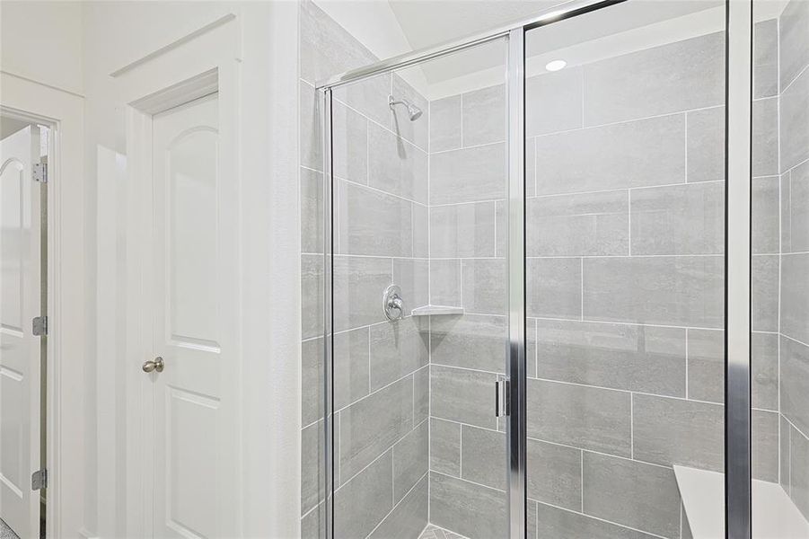 Bathroom featuring a shower with shower door