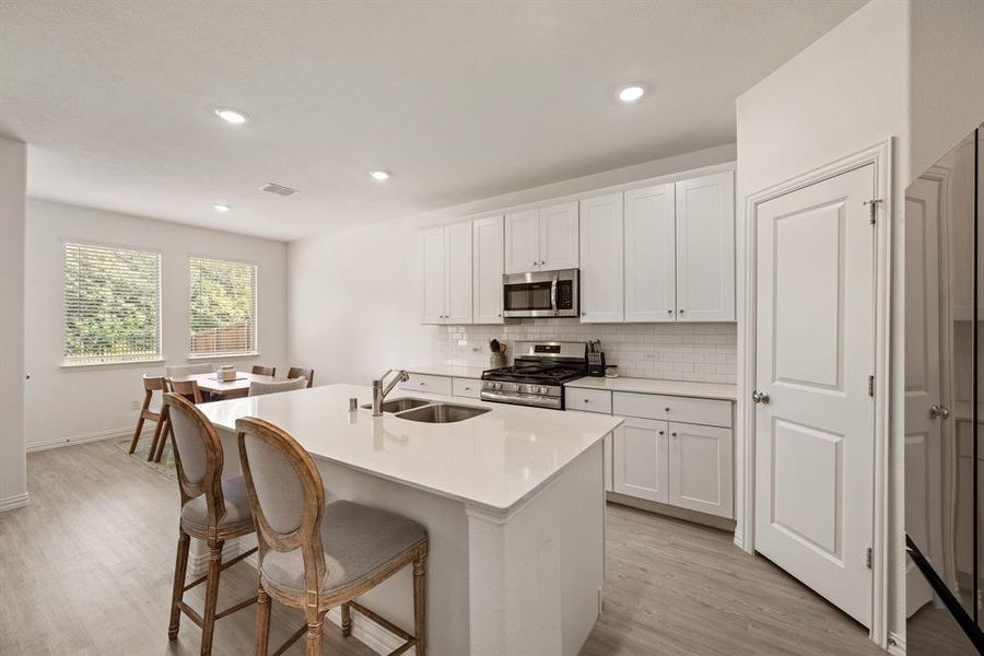 Furnished interior view inside a new home in Hurricane Creek: Classic 60s, Anna (Image 5). Furnished interior view inside a new home in Hurricane Creek: Classic 60s, Anna (Image 5).