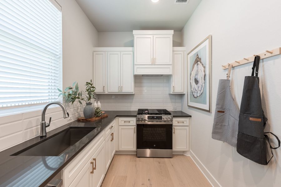 Representative furnished interior of a home built from the Woodbridge by Tri Pointe Homes in Bridgeland, Cypress (Image 18).