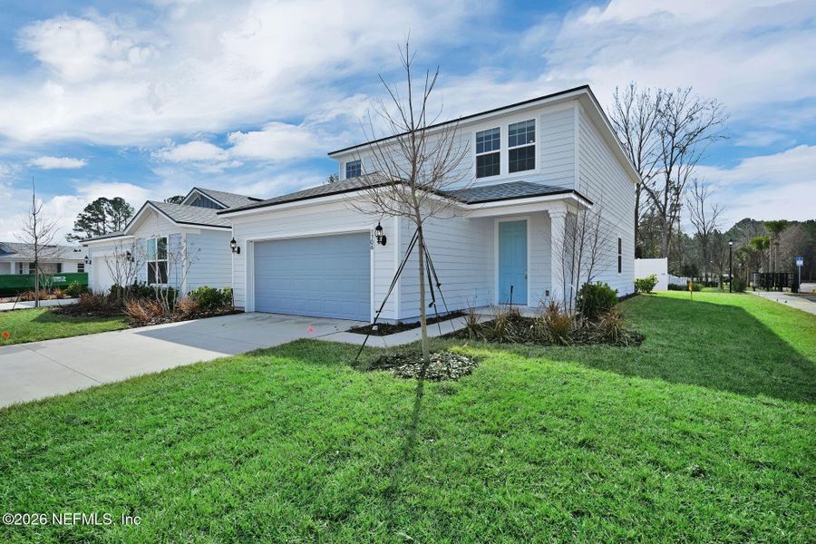 Front exterior of a new home in Murray Farms, Middleburg, FL, highlighting curb appeal (Image 26).