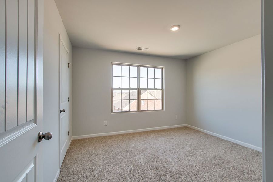 Representative unfurnished interior of a home built from the HAYDEN by D.R. Horton in The Parks, White House (Image 23).