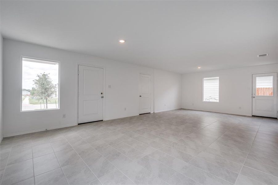 Spare room featuring light tile floors Spare room featuring light tile floors