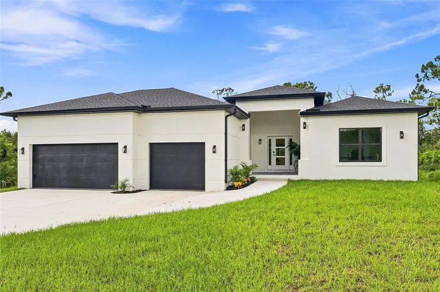 Front exterior of a new home in , Port Charlotte, FL, highlighting curb appeal (Image 27). Front exterior of a new home in , Port Charlotte, FL, highlighting curb appeal (Image 27).