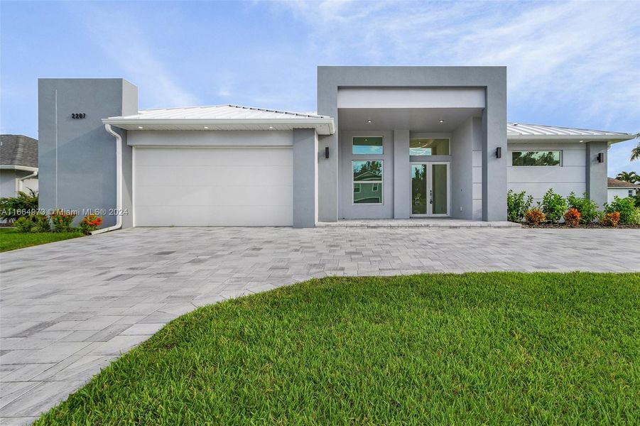 Front exterior of a new home in , Cape Coral, FL, highlighting curb appeal (Image 13).