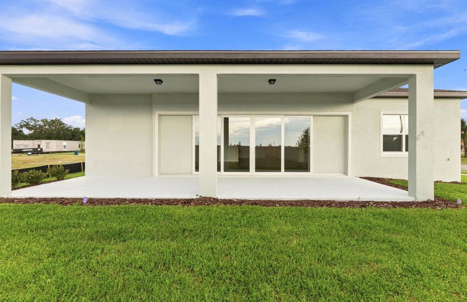 Exterior details and patio area of a home in Riversong, Parrish (Image 4).