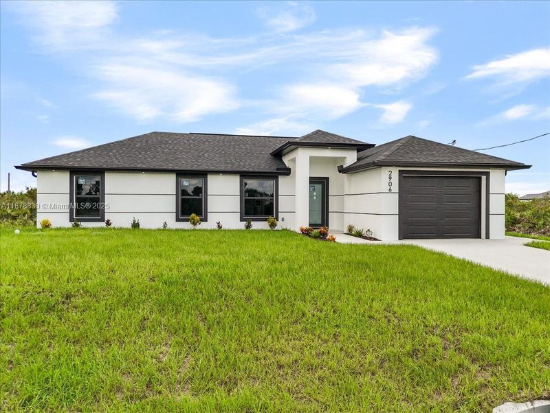 Front exterior of a new home in , Lehigh Acres, FL, highlighting curb appeal (Image 2).