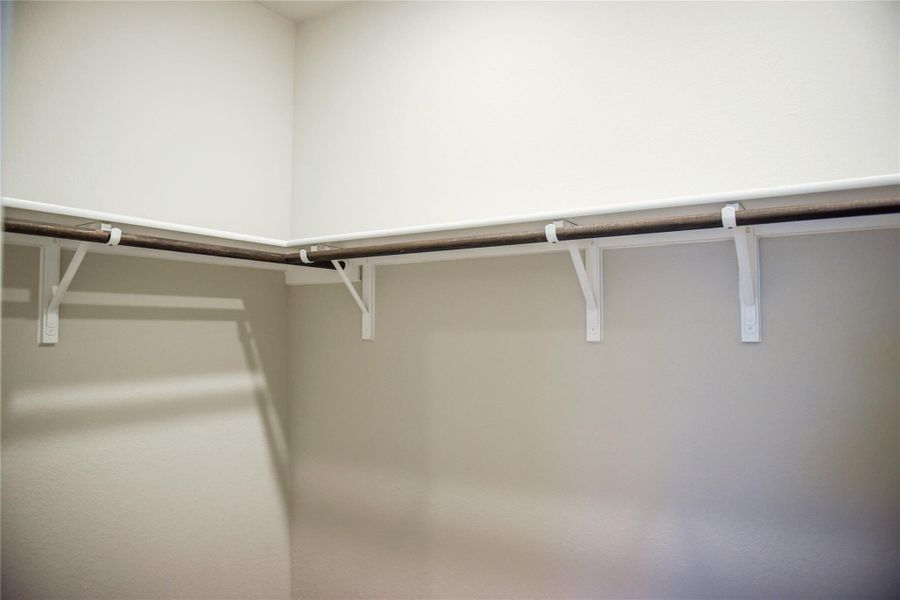 Walk-in closet in Primary Bedroom Walk-in closet in Primary Bedroom