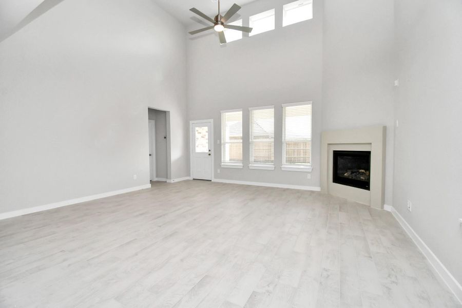 Discover another perspective of the heart of the house! Sample photo of completed home with similar floor plan. Actual colors and selections may vary.