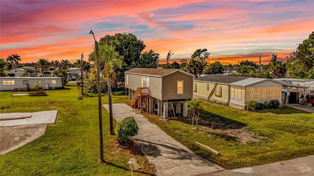 Front exterior of a new home in , Port Charlotte, FL, highlighting curb appeal (Image 16). Front exterior of a new home in , Port Charlotte, FL, highlighting curb appeal (Image 16).