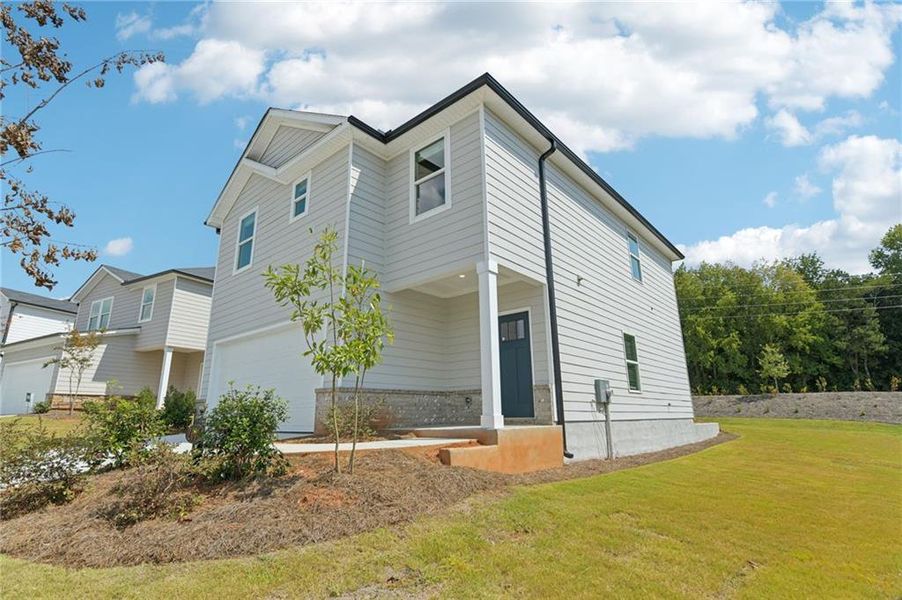 Exterior details and patio area of a home in Avalon - Reserve Series, Conyers (Image 22).