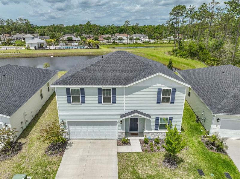 Front exterior of a new home in , Palm Coast, FL, highlighting curb appeal (Image 23). Front exterior of a new home in , Palm Coast, FL, highlighting curb appeal (Image 23).