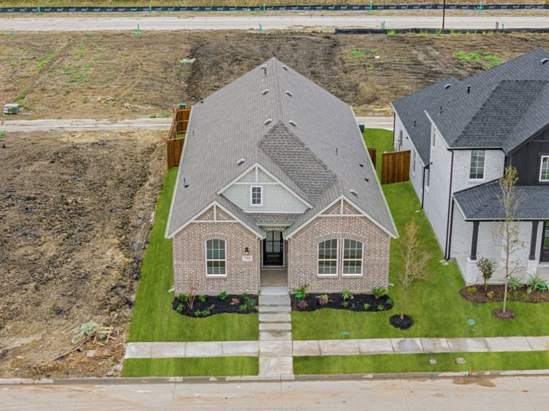 Representative exterior photo of a completed home built from the Cedar by UnionMain Homes in Edgewater, Fate, TX (Image 25). Representative exterior photo of a completed home built from the Cedar by UnionMain Homes in Edgewater, Fate, TX (Image 25).