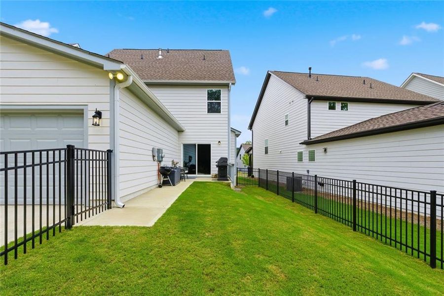 Exterior details and patio area of a home in Marble Tree, Ball Ground (Image 4).