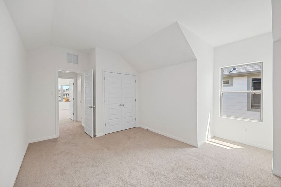Bedroom in the Elm home plan by Trophy Signature Homes – REPRESENTATIVE PHOTO