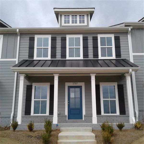 Front exterior of a new home in , Conyers, GA, highlighting curb appeal (Image 1). Front exterior of a new home in , Conyers, GA, highlighting curb appeal (Image 1).