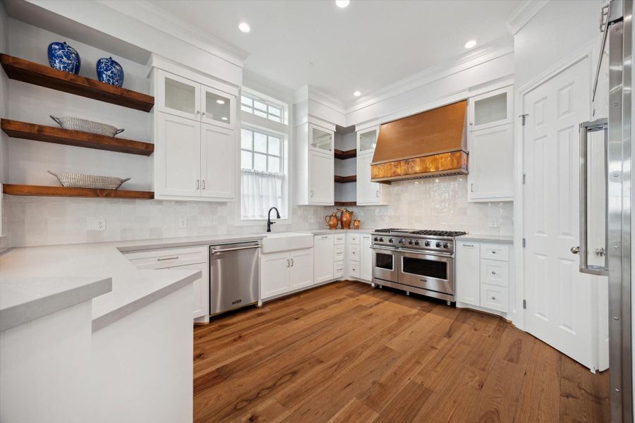 Beautiful kitchen with custom cabinetry. Plenty of storage with designer finishes.