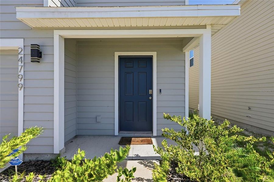 Exterior details and patio area of a home in Avalon Woods, Newberry (Image 27).