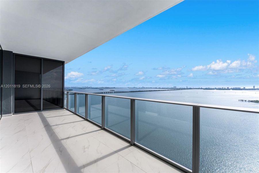 Breathtaking panoramic sunrise views of Biscayne Bay and the Atlantic Ocean from the expansive private terrace of Aria Reserve #2504 in Edgewater, Miami.