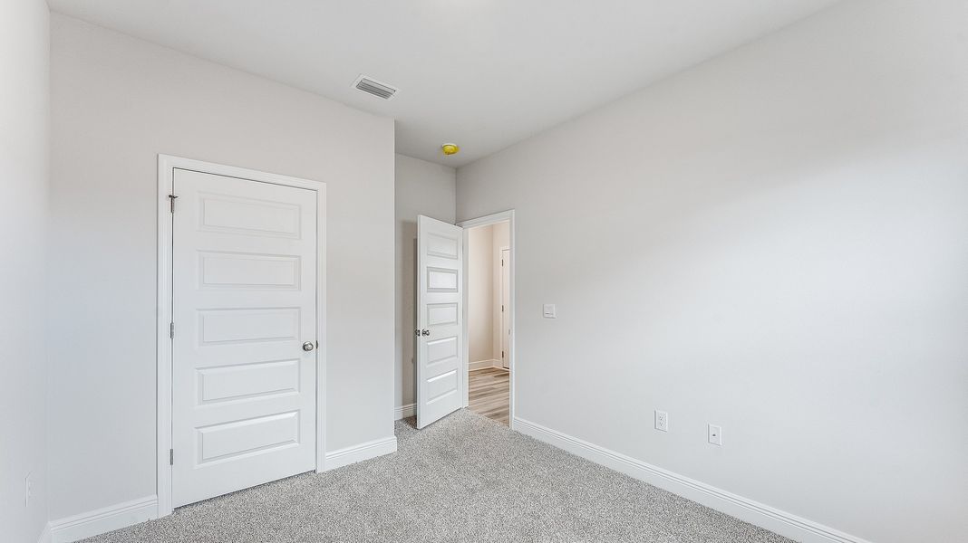 Representative unfurnished interior of a home built from the The Riverside by D.R. Horton in Hodges Bayou Plantation, Panama City (Image 19).
