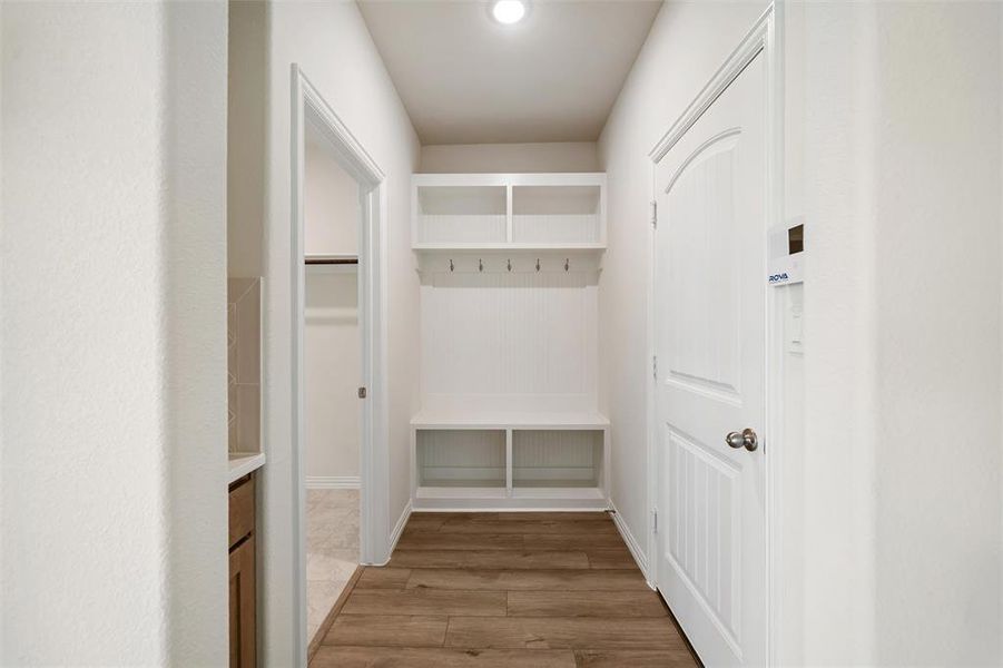 Mudroom featuring light wood-style flooring