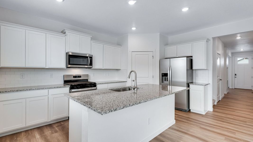 Furnished interior view inside a new home in Trails at Crowfoot, Parker (Image 6).