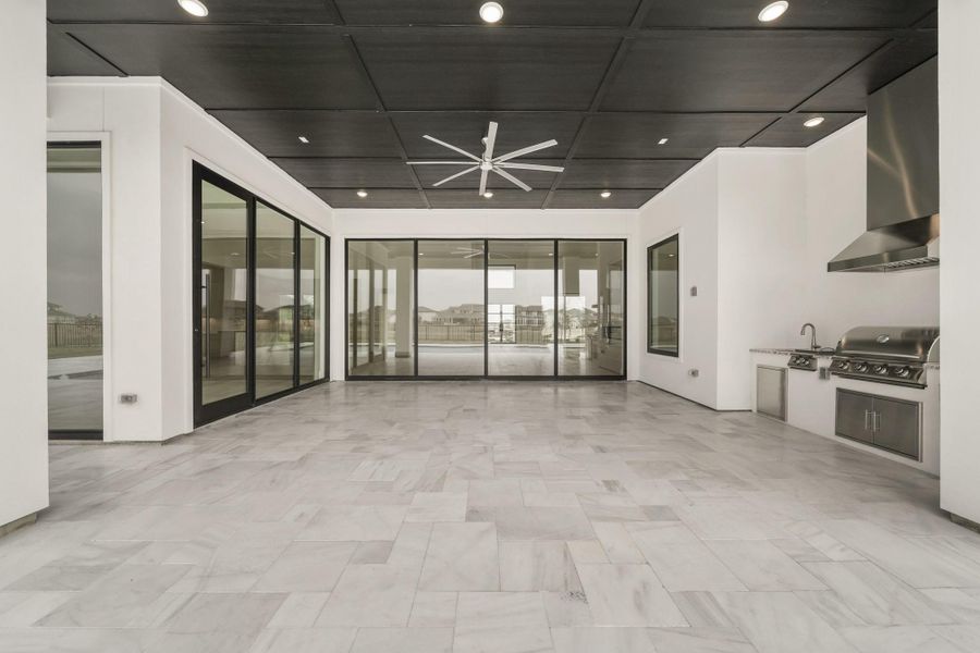 Exterior details and patio area of a home in Bridgeland, Cypress (Image 26).