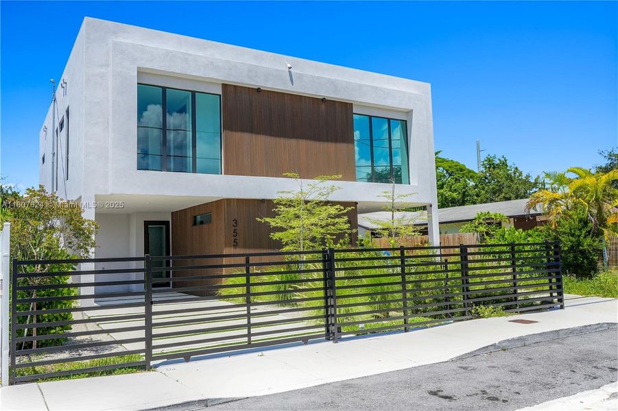 Front exterior of a new home in , Miami, FL, highlighting curb appeal (Image 16). Front exterior of a new home in , Miami, FL, highlighting curb appeal (Image 16).