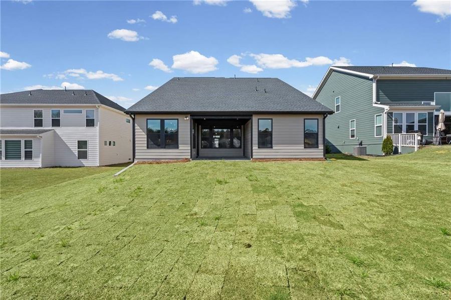 Exterior details and patio area of a home in Twin Lakes, Hoschton (Image 29).