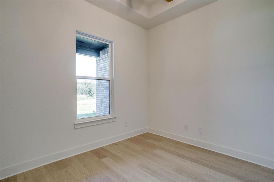 Unfurnished room featuring light wood-type flooring