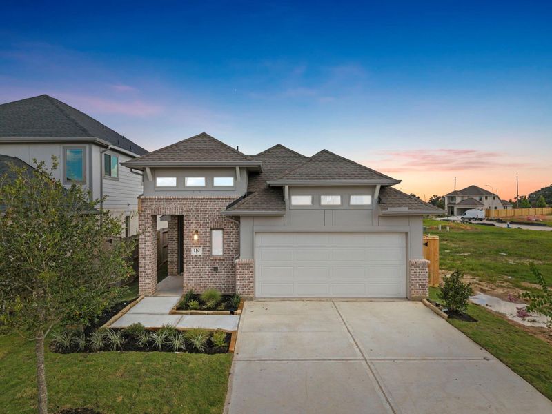 Front exterior of a new home in Candela, Richmond, TX, highlighting curb appeal (Image 2). Front exterior of a new home in Candela, Richmond, TX, highlighting curb appeal (Image 2).