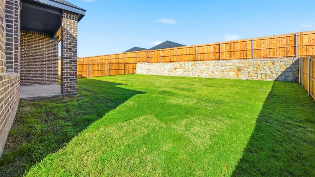 Fenced backyard featuring a patio area