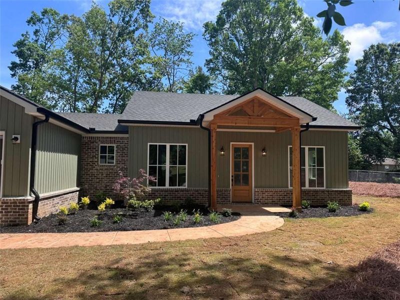Front exterior of a new home in , Gainesville, GA, highlighting curb appeal (Image 1). Front exterior of a new home in , Gainesville, GA, highlighting curb appeal (Image 1).